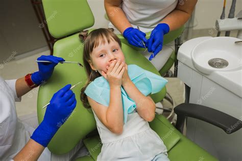 Premium Photo Girl At Dentist Being Scared Of Equipment