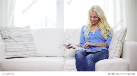 Woman Reading Magazine At Home Stock Video Footage 4900820