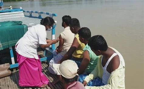 On Boats Assam Health Workers Take Vaccine To River Islands Amid Floods