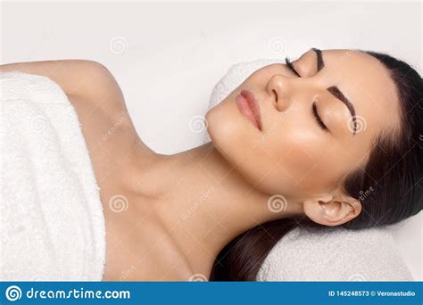Portrait Of Young Beautiful Woman In Spa Salonspa Body Massage