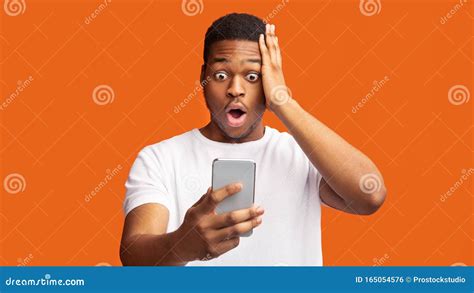 Nervous Guy Seeing Bad News Phone Stock Photos Free And Royalty Free