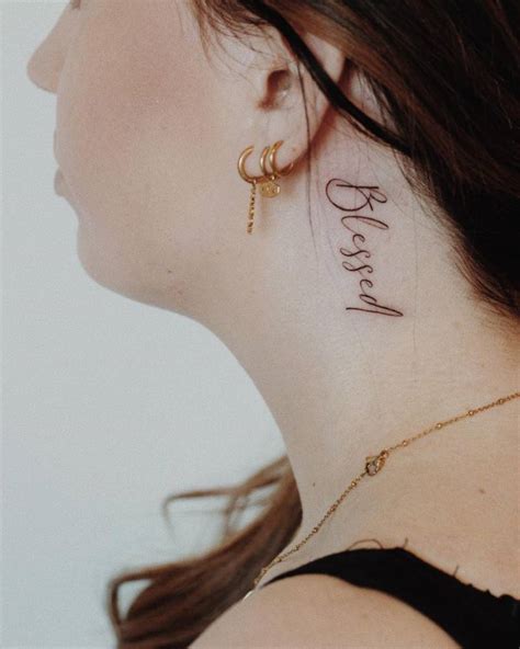 Blessed Lettering Tattoo On The Neck