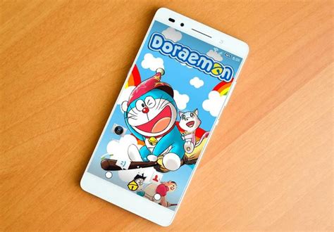 An Image Of A Phone On A Table With Cartoon Characters And Games Coming