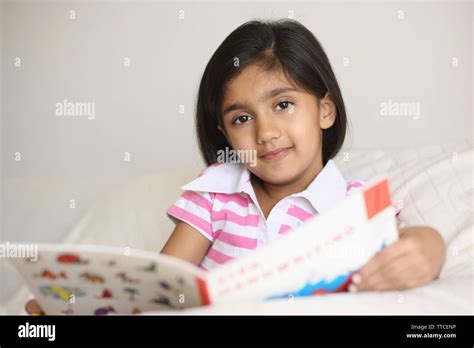 Girl Reading A Book Stock Photo Alamy
