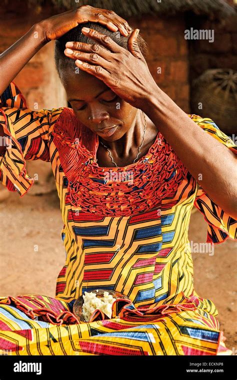 Burkina Faso Bobo Dioulasso Toussiana Portrait Of A Woman Trying To