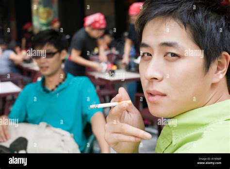 Young Man Smoking Stock Photo Alamy