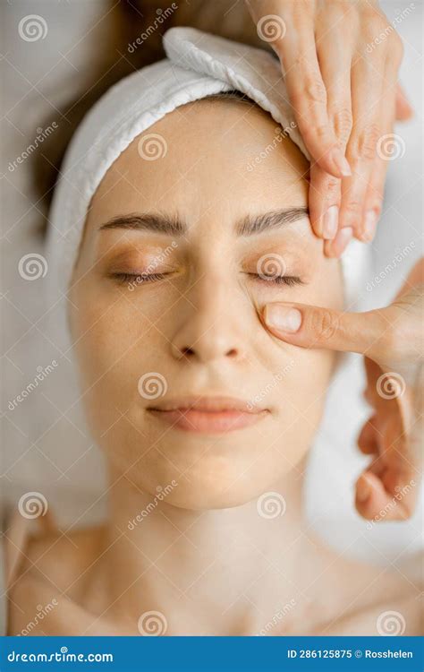 Beautician Makes A Face Massage For A Woman Stock Image Image Of