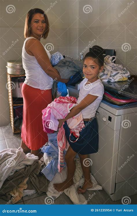 Its Laundry Day Portrait Of A Mother And Babe Standing With A Pile Of Laundry To Wash