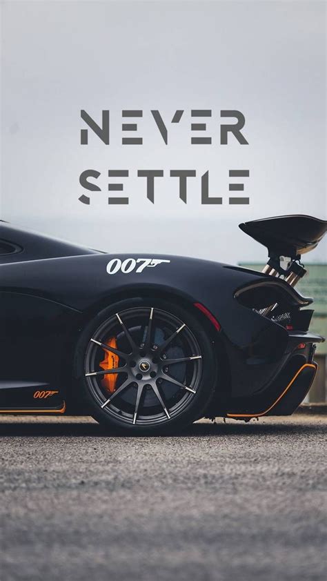 A Black Sports Car With The Words Never Settle On It