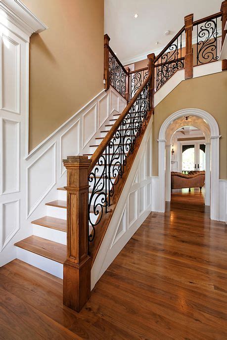 Traditional Two Story Entry Foyer With Staircase And Custom Oak And