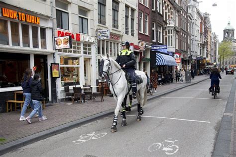 amsterdam netherlands mounted police patrol officers patrol in the center of amsterdam 2021 05