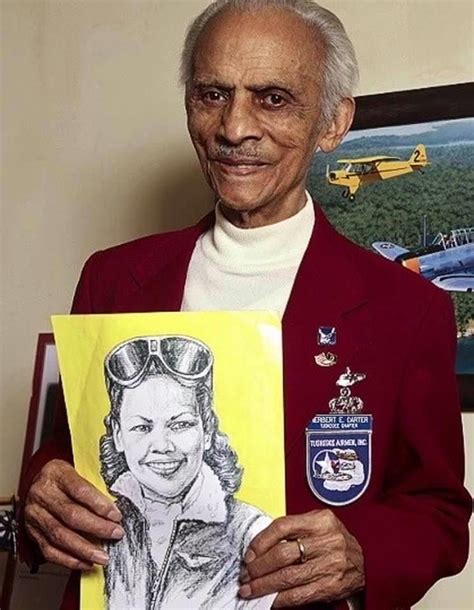 The Legendary Tuskegee Airmen Col Herbert Carter Holds A Drawing Of