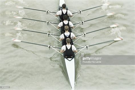 Rowing Team Rowing Scull Oars Out Of Water High Angle View High Res