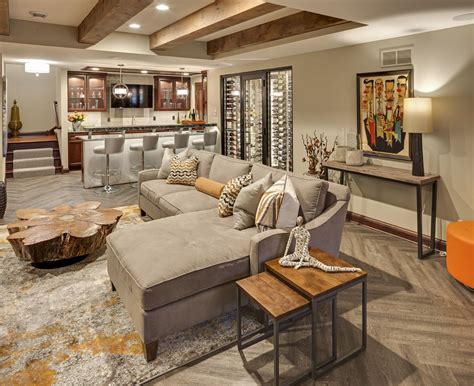 Modern Lower Level Finish Featuring Reclaimed Beams Wet Bar And Game