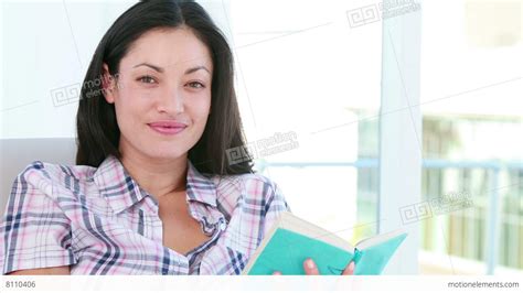Pretty Brunette Woman Reading A Book Stock Video Footage 8110406