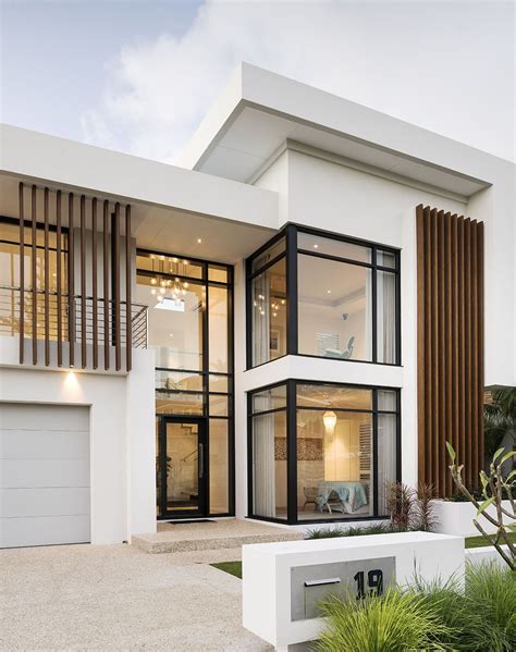 This Stunning Contemporary Two Storey Home Has Been Shaped To Fit The Contours Of A Sloping