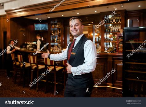 Portrait Smiling Waiter Welcoming Guests Hotel Stock Photo 1660596961