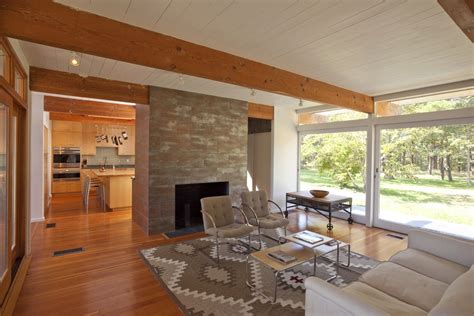 This post and beam home in denver, colorado, is now open and inviting thanks to a renovation that focused on bring the home back to its they had the drywall repaired and the flooring throughout the house redone in red oak common #1, a popular hardwood choice during the mid century. Inspired post and beam construction Midcentury Living Room