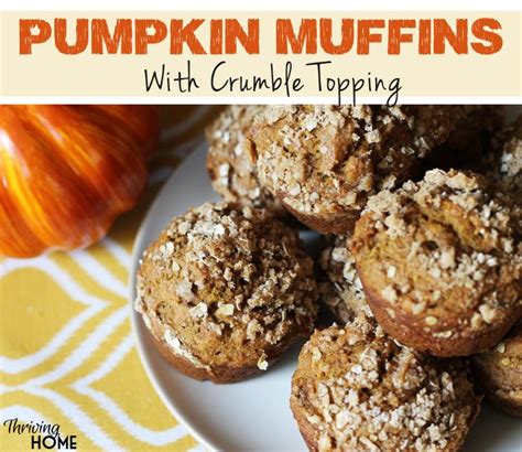 Pumpkin Muffins With Crumble Topping On A White Plate Next To An Orange