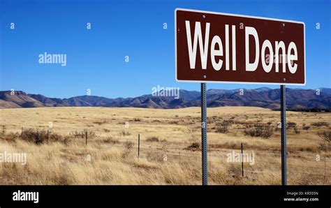 Well Done Brown Road Sign Stock Photo Alamy