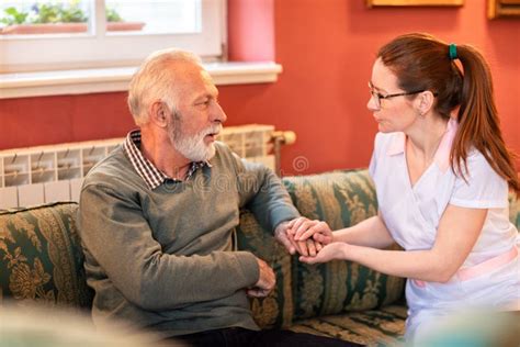 Loving Nurse Talking With Senior Man Stock Image Image Of Hand
