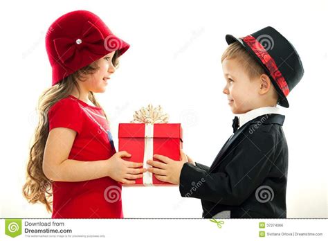 If you're close with your mom, give her a gift on your. Little Boy Giving Girl Gift Stock Photo - Image of ...