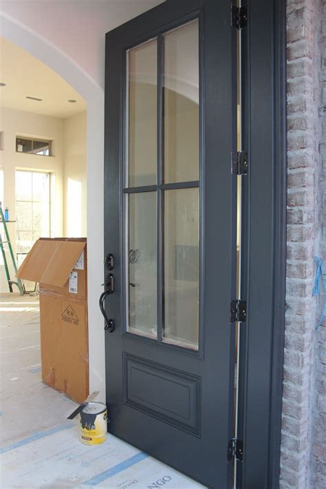 Depending on the light, benjamin moore wrought iron can look black or gray. Door painted in Benjamin Moore Wrought Iron. One of the best dark door and trim colors ...