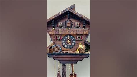 M448 12 12 One Day Musical Cuckoo Clock Cottage With Man Chopping Wood