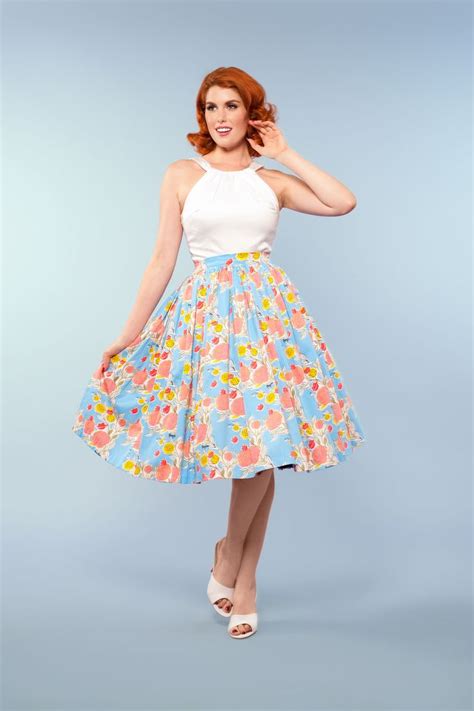 Pinup Couture Jenny Skirt In Mary Blair Lips And Roses Print In Blue