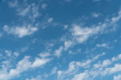 Blue Sky With A Few Scattered White Clouds Stock Photo Image Of Blue