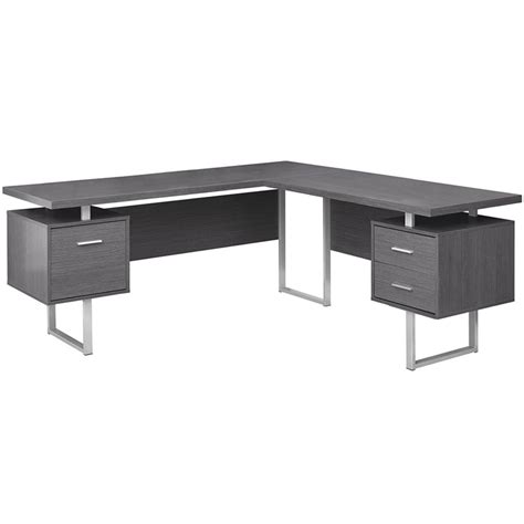 A corner desk is specifically built to fit into a corner, thereby saving on space or making the most of it. Monarch L Shaped Corner Computer Desk in Gray - I 7306