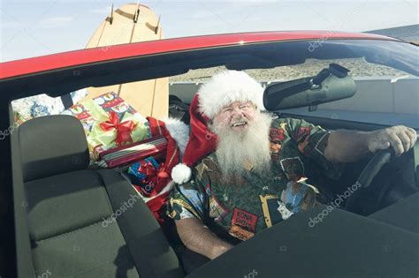 Father Christmas In Convertible With Surfboard — Stock Photo