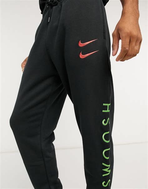 Nike Swoosh Cuffed Sweatpants In Black For Men Lyst
