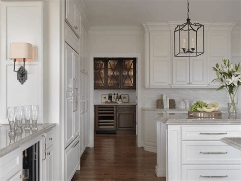 Something dark contracted with white cabinets will look beautiful. Traditional White Kitchen - Beck/Allen Cabinetry