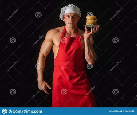 Man In Chefs Hat With Sweet Homemade Stack Of Pancakes With Syrup
