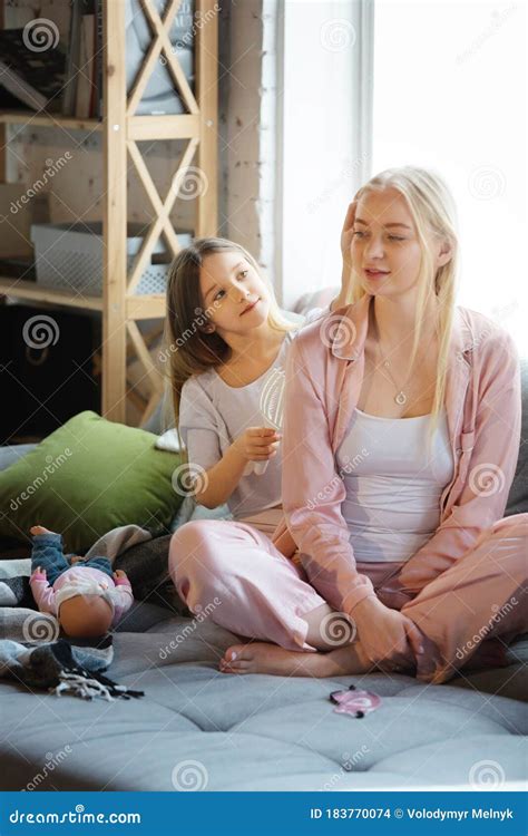 Mother And Daughter Sisters Have Quite Beauty And Fun Day Together At Home Comfort And