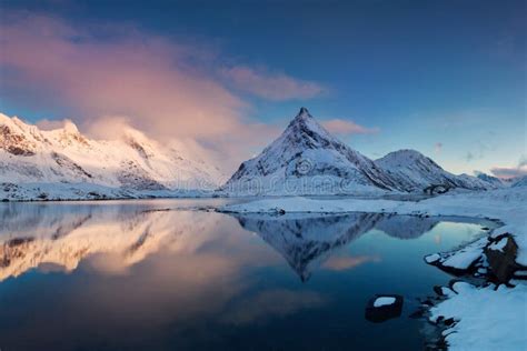 Panoramic Landscape Winter Mountains And Fjord Reflection In Water