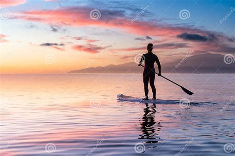 Adventurous Girl On A Paddle Board Is Paddeling In The Pacific West