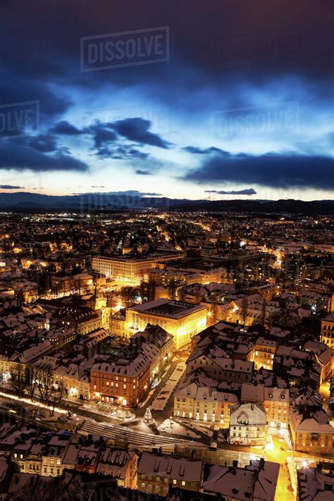 Illuminated Cityscape At Dusk Stock Photo Dissolve