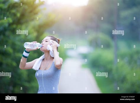 Women Drink Water After Exercising Stock Photo Alamy