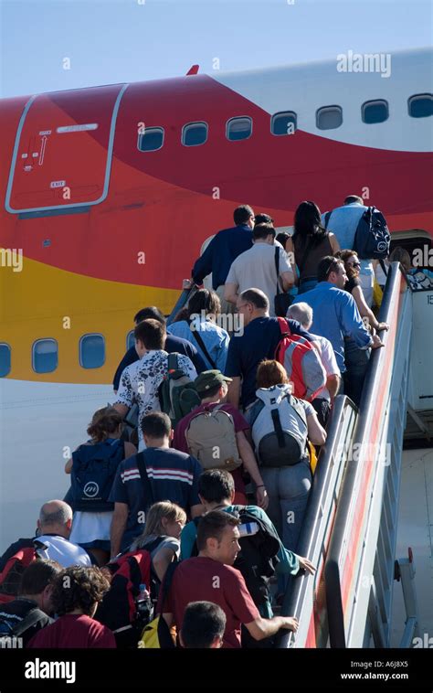 Passengers Boarding A Plane At Madrid Barajas Airport Madrid Spain