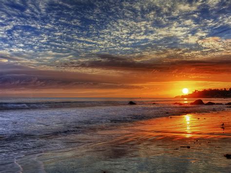 Sunset Red Sky Clouds Sea Waves Sandy Beach In Malibu California United