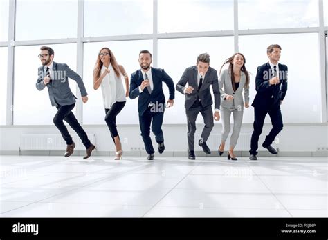 Successful Business Team Running In The Office Hall Stock Photo Alamy