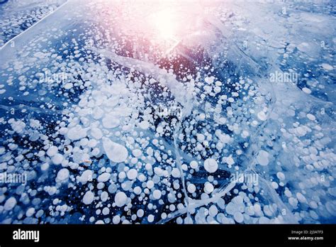 Gas Methane Bubbles Frozen In Winter Ice Of Lake Baikal Abstract