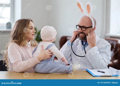 Mother With Baby Visiting Pediatrician Stock Photo Image Of Baby