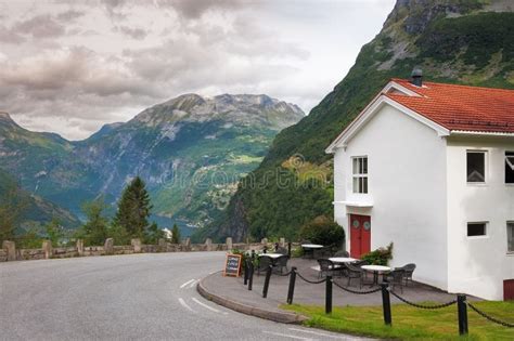 Cottage Mountains And Clouds In Geiranger Norway Stock Photo Image