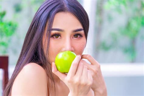 Pretty Woman Holding Green Apple For Healthy Fruit Eating And Healthy