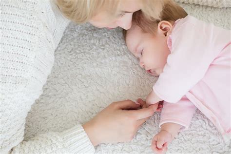 Mother Puts Her Baby Daughter To Sleep Stock Image Image Of Bonding