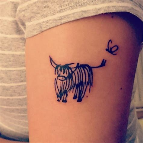 White (wheaten) scottish terrier, sitting on the snow during winter. Highland cow tattoo 😍 | Scottish tattoos, Cow tattoo ...