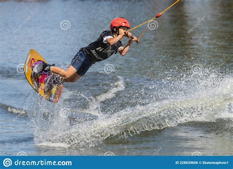 An Athlete Trains And Shows Tricks On The Water While Doing Sports